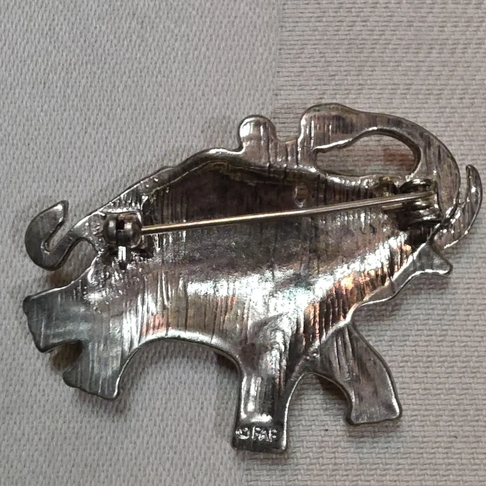 1928 beast brooches